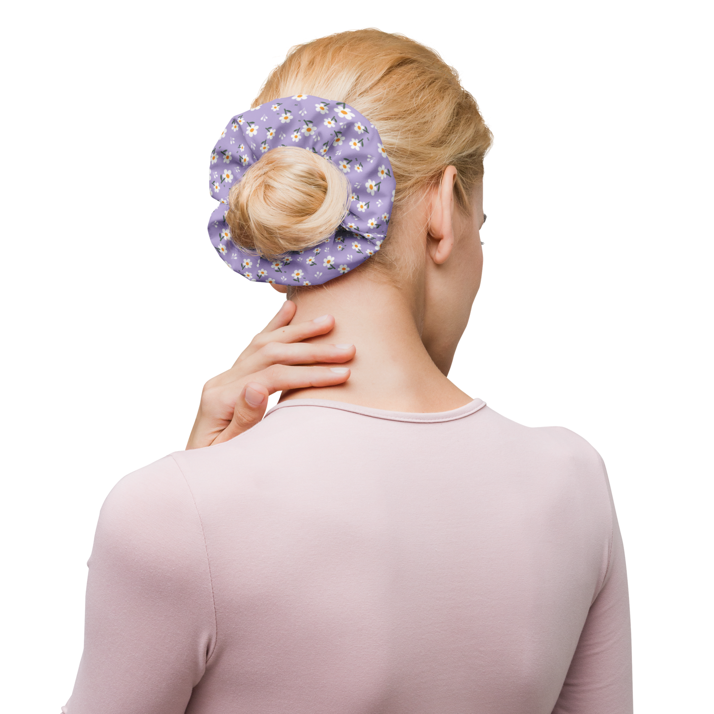 Woman using a purple floral scrunchie on a bun