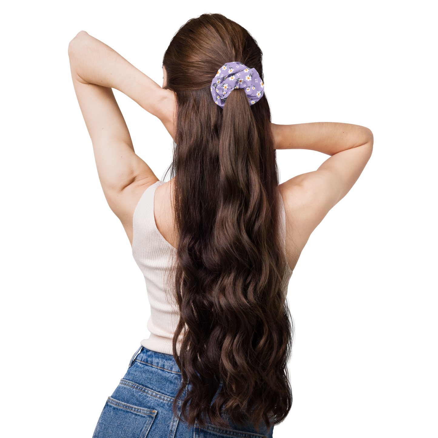 Woman with long wavy hair tied back with a scrunchie on a white background