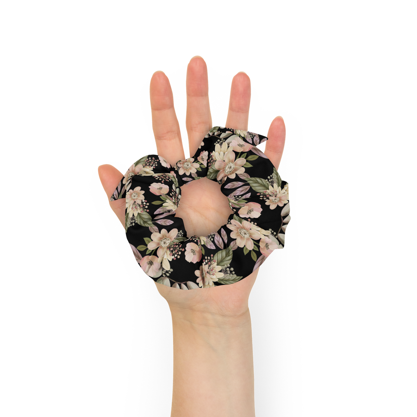 Hand holding a floral-patterned hot water bottle cover against a white background