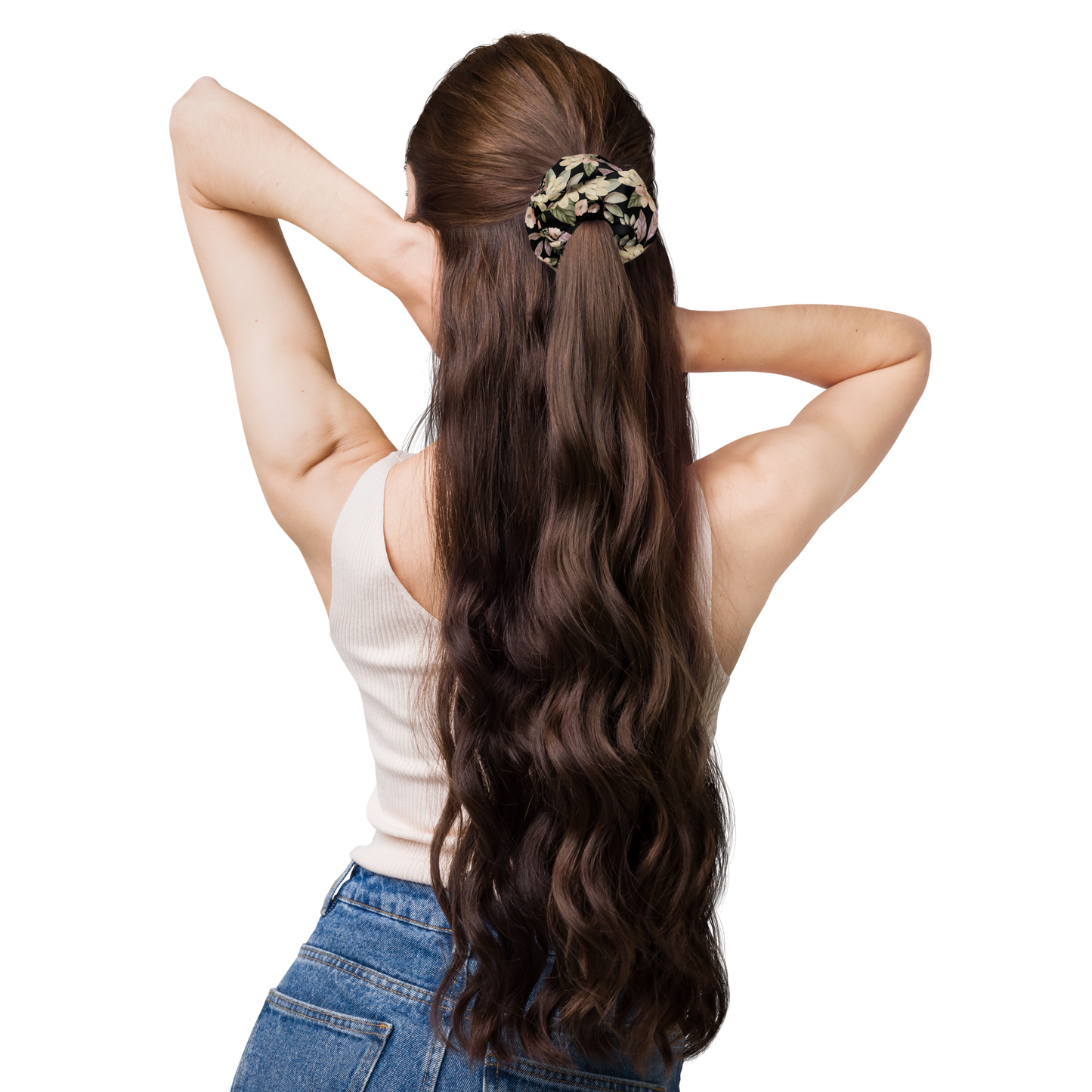 Woman with long wavy hair tied back with a scrunchie on a white background