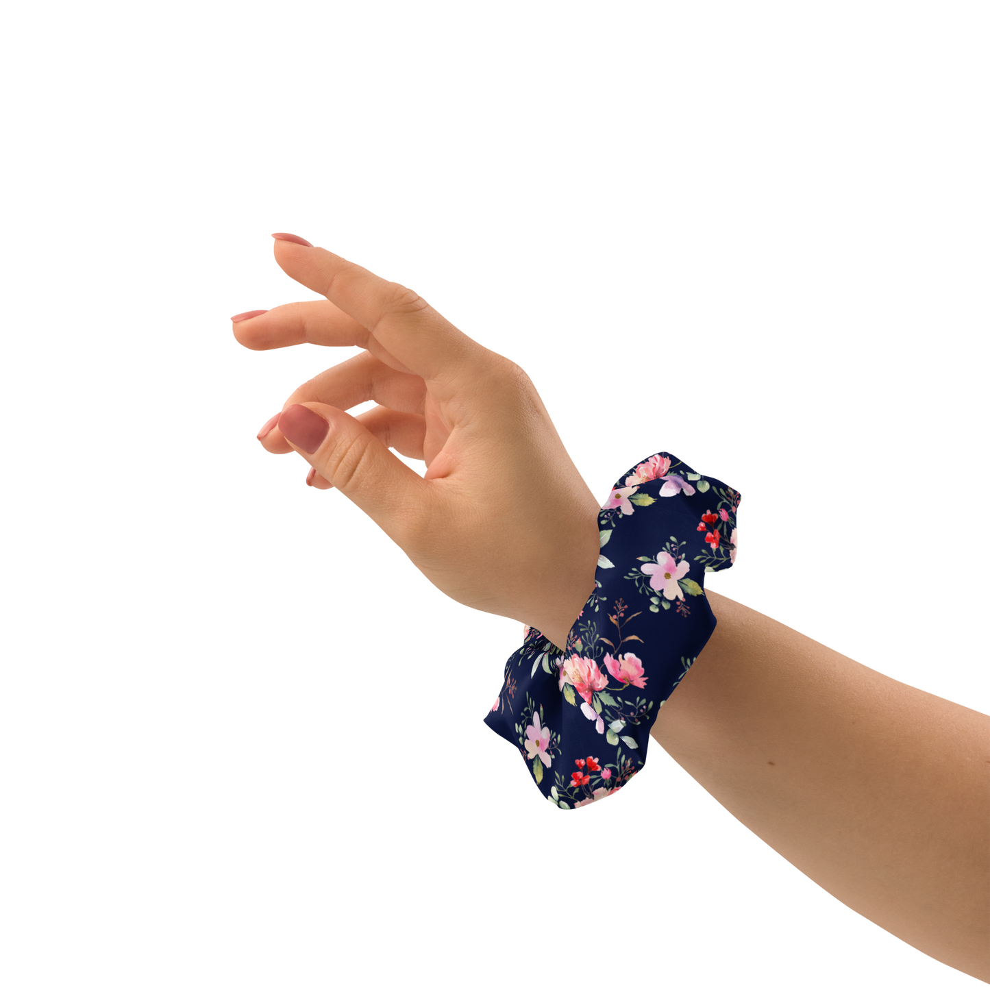 Hand wearing a floral scrunchie on a white background
