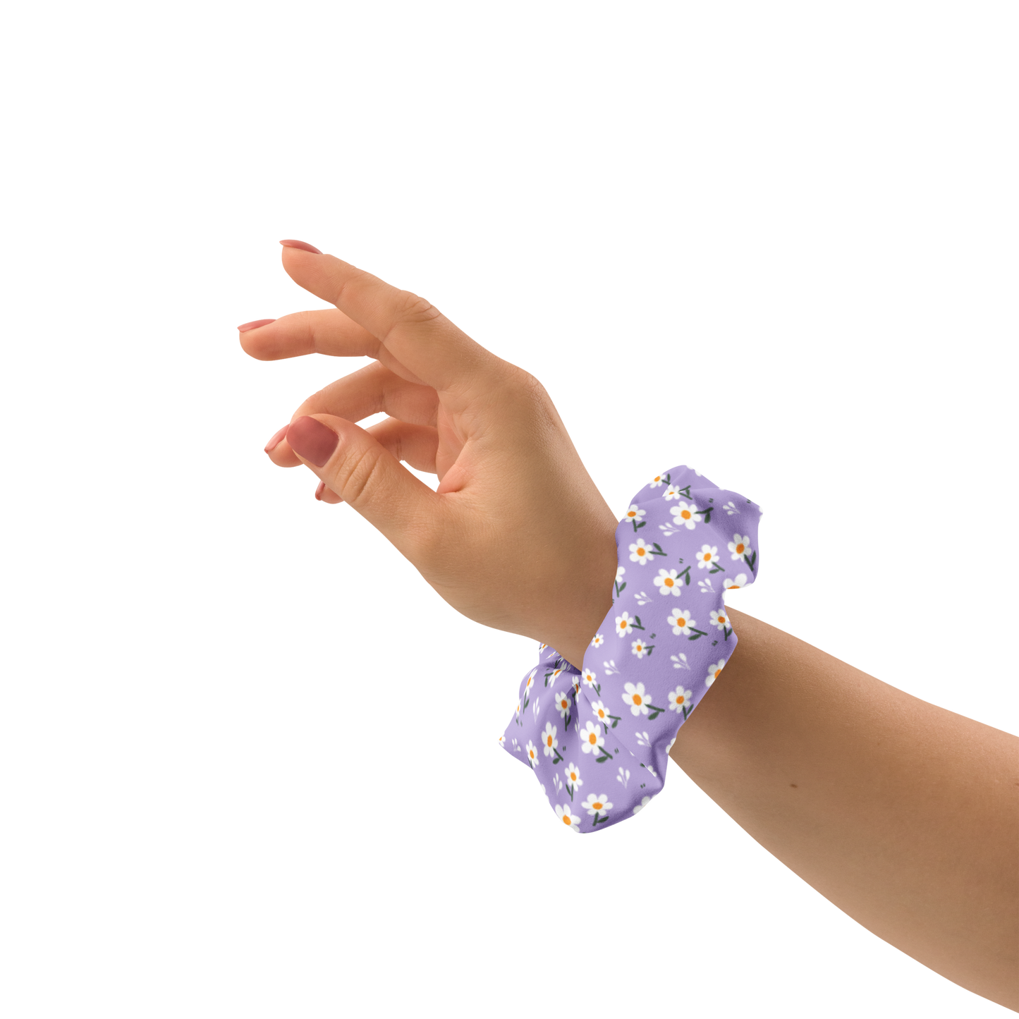 Hand wearing a purple floral scrunchie on a white background