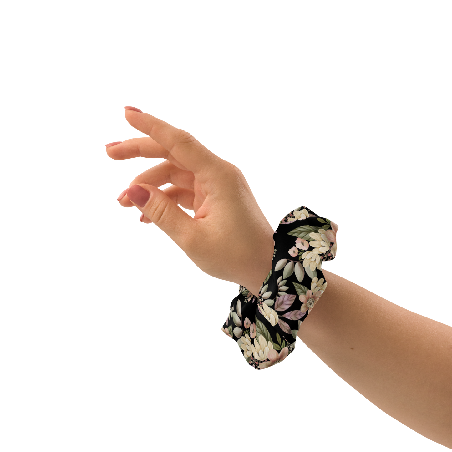 Hand wearing a floral scrunchie on a white background