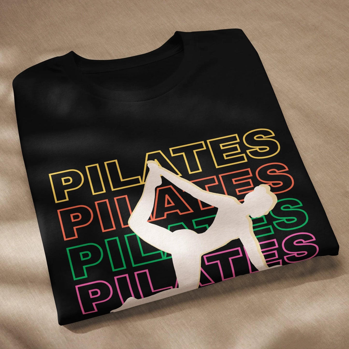 Woman wearing colorful Pilates t-shirt with bold fitness design – perfect for active lifestyle, gym, and wellness lovers