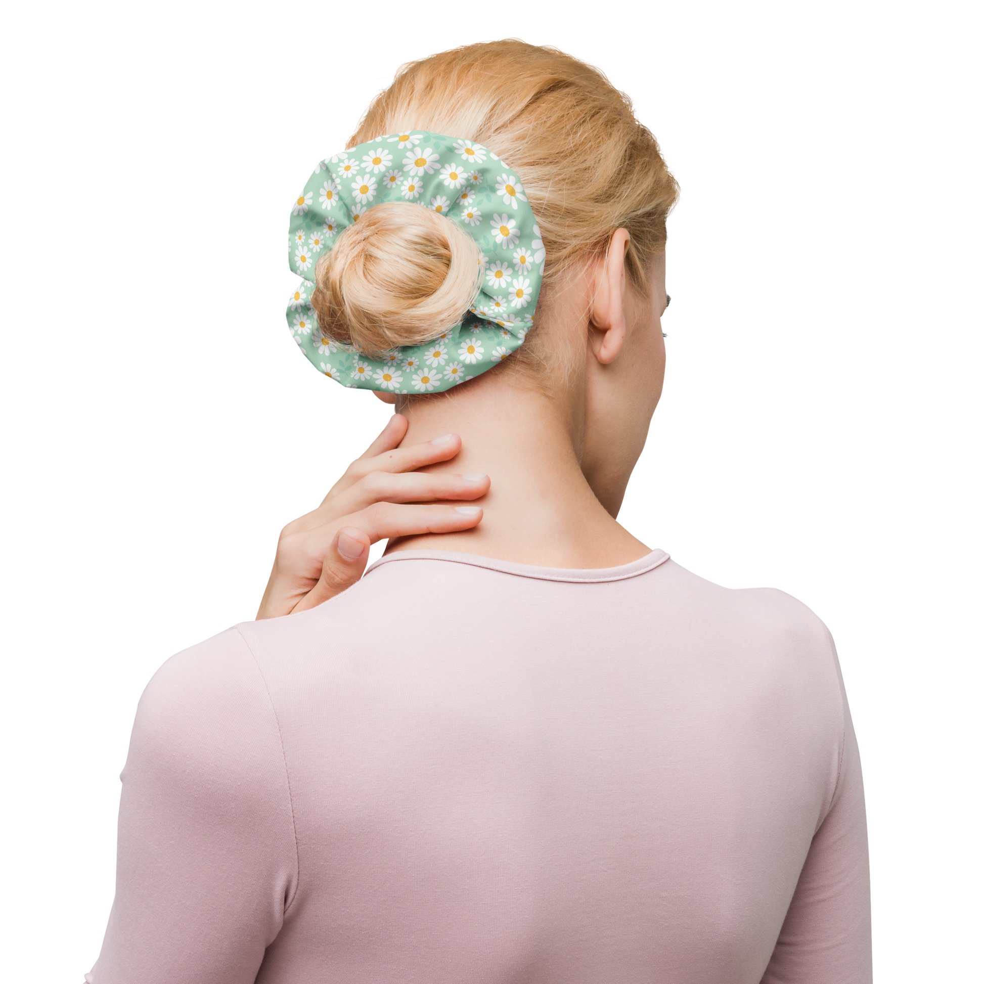 Woman using a floral scrunchie on her hair bun