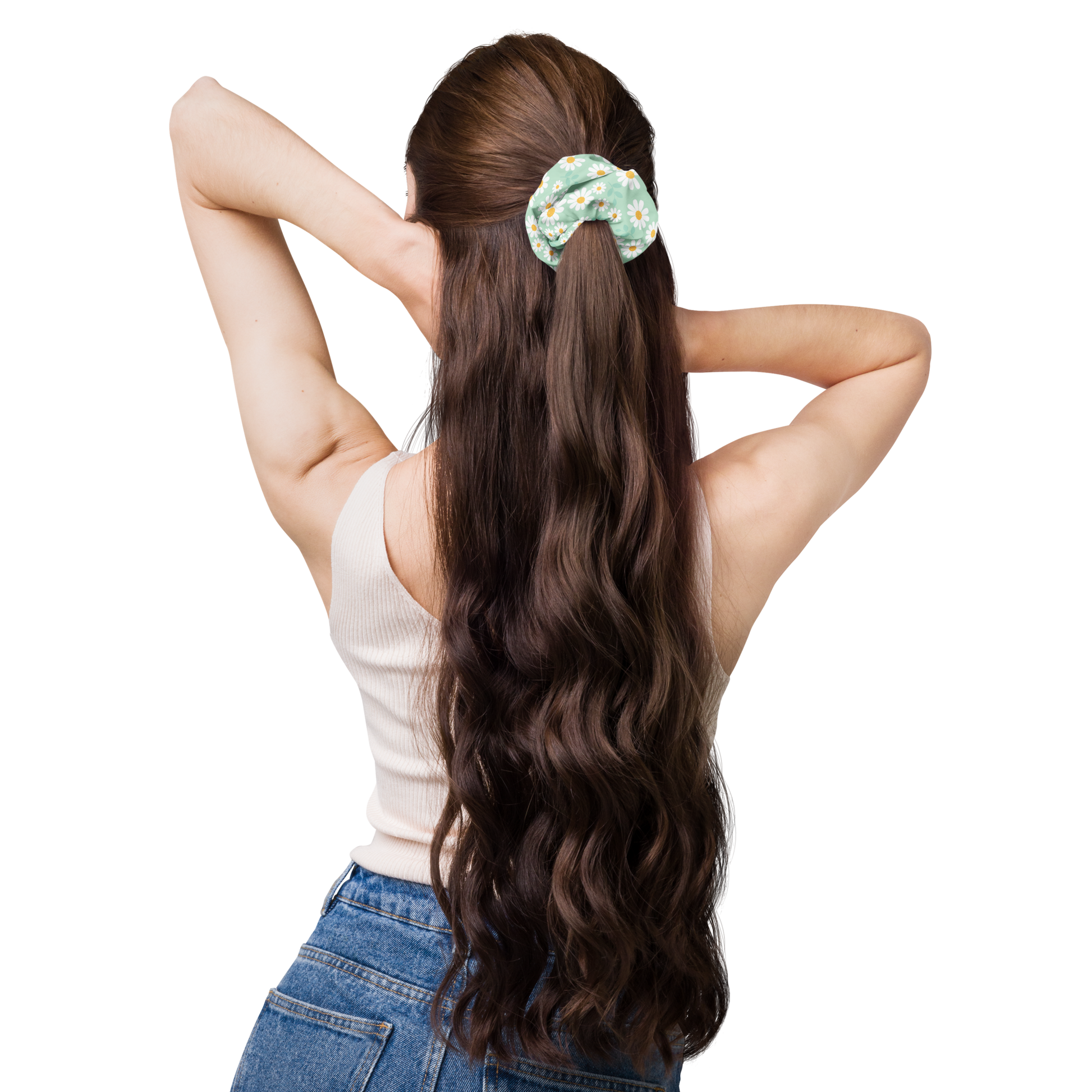 Woman with long wavy hair wearing a scrunchie on a white background