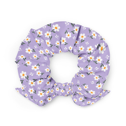 Purple scrunchie with floral pattern on a white background
