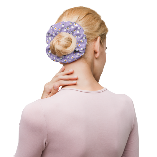 Woman using a purple floral scrunchie on a bun