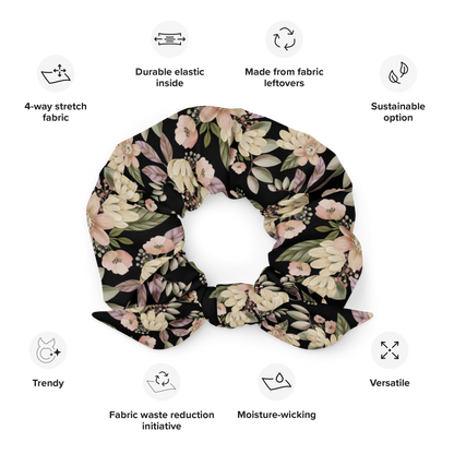 Floral patterned scrunchie with sustainability features listed on a white background