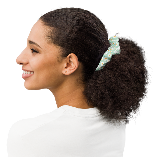 Woman with a floral scrunchie in her hair on a white background