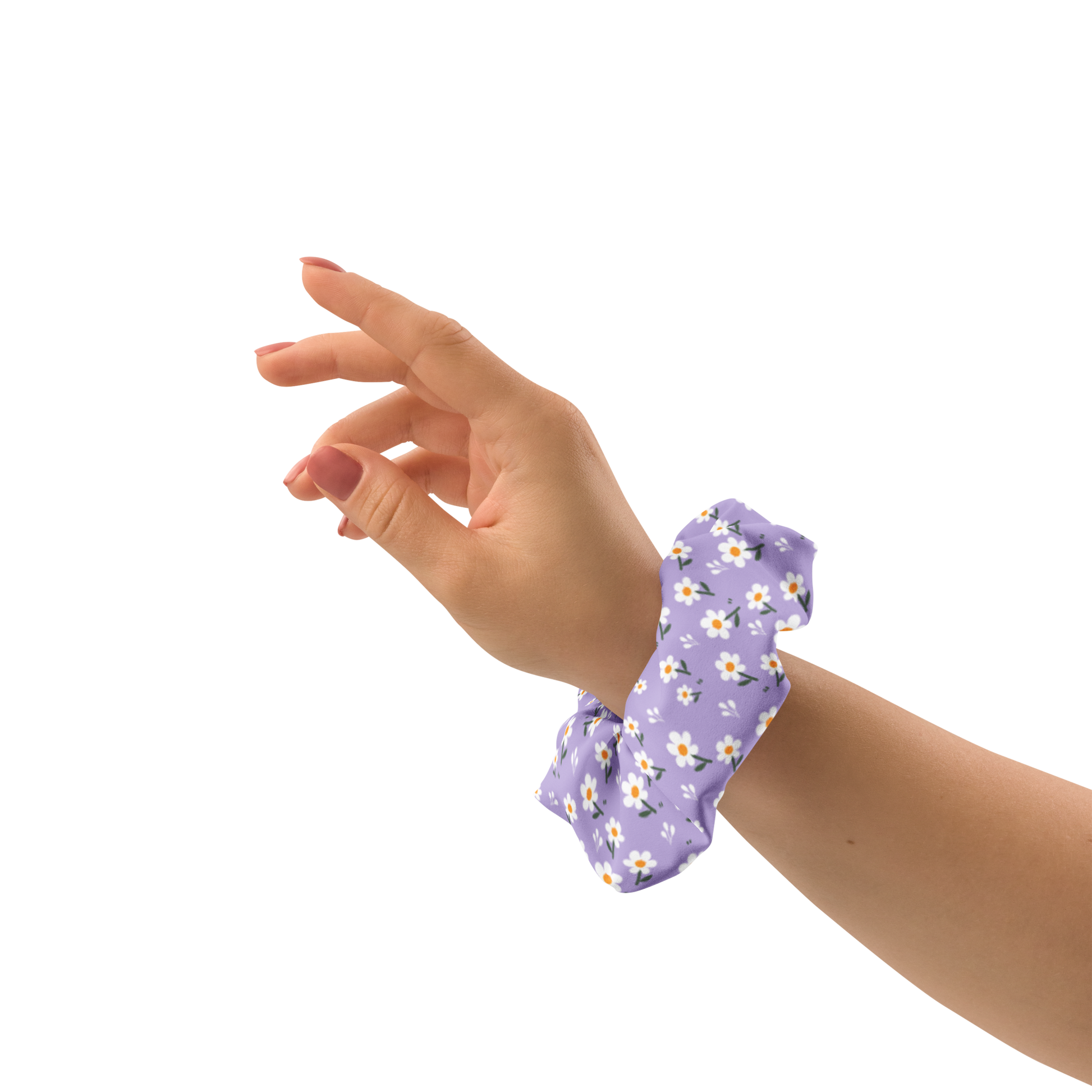 Hand wearing a purple floral scrunchie on a white background