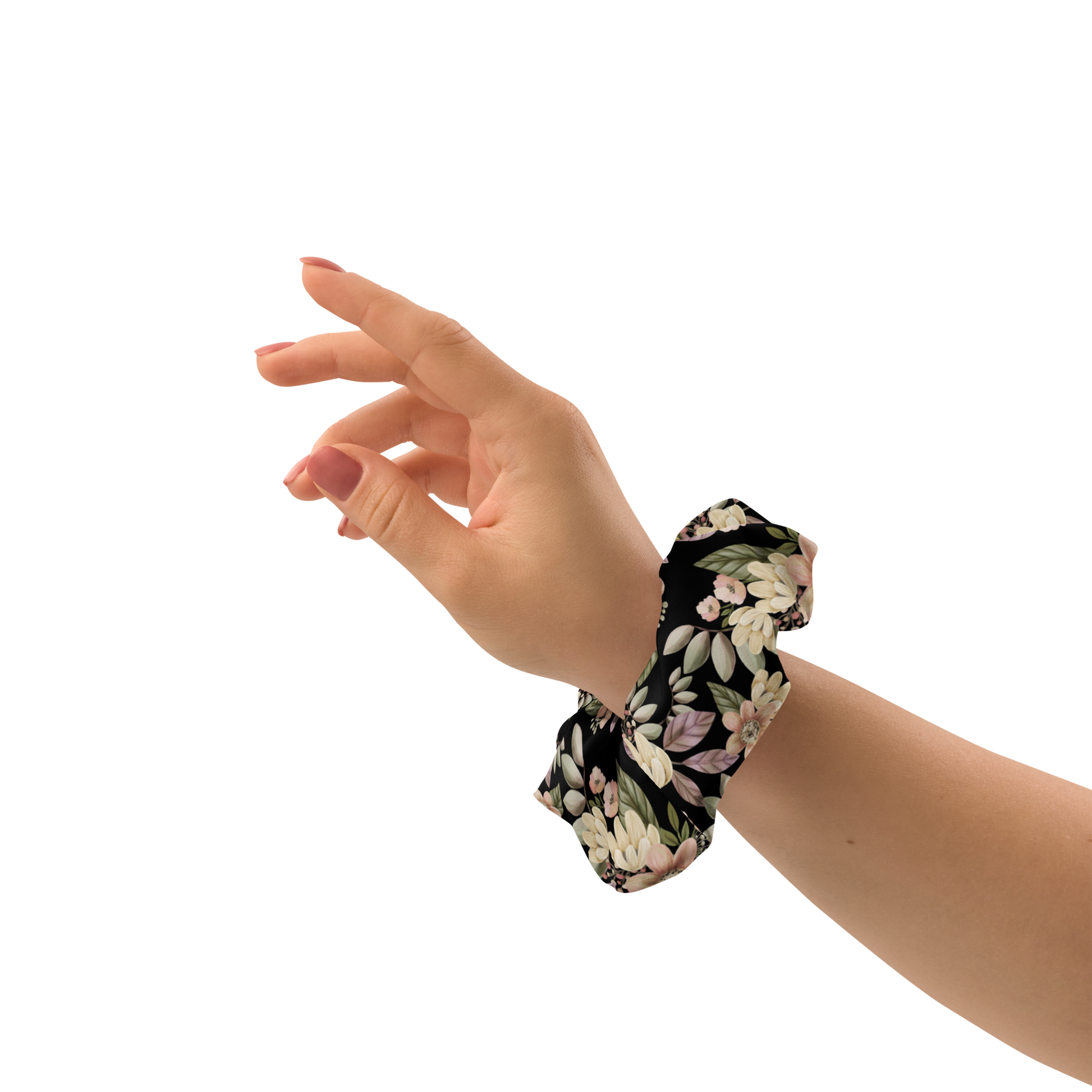 Hand wearing a floral scrunchie on a white background