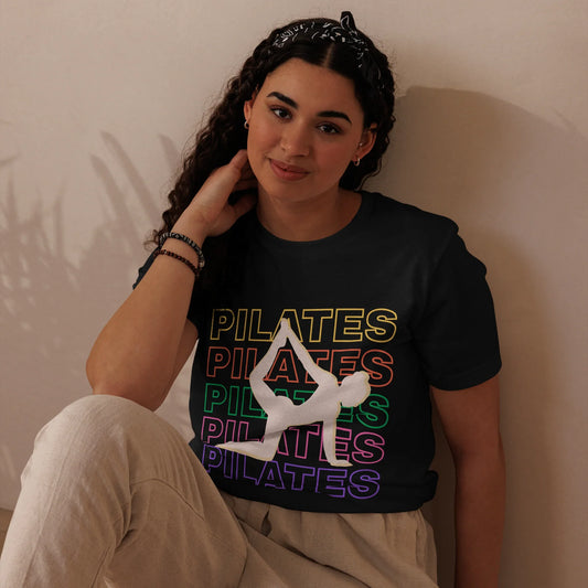 Woman wearing colorful Pilates t-shirt with bold fitness design – perfect for active lifestyle, gym, and wellness lovers