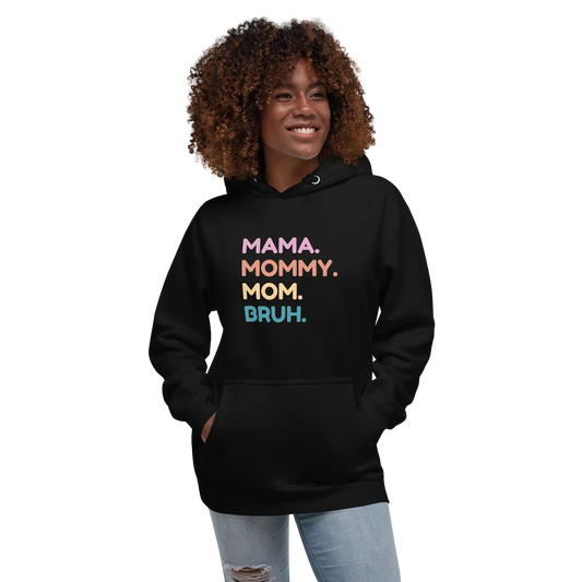 Person wearing a black hoodie with colorful text on a white background