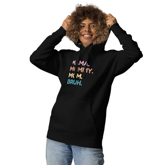 Person wearing a black hoodie with colorful text design on a white background