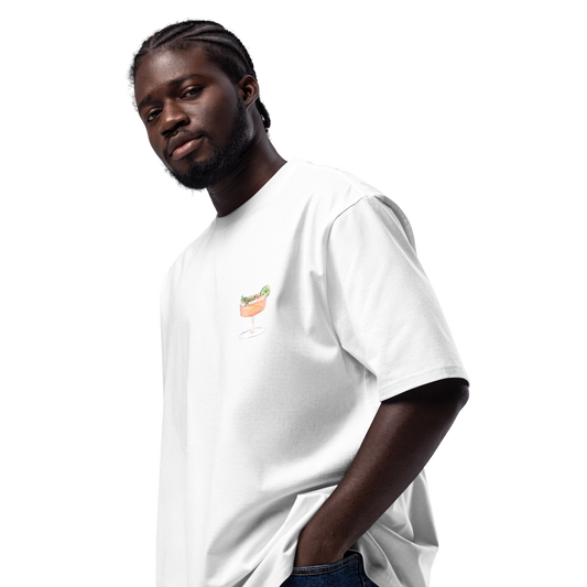 Man wearing a white t-shirt with a small maragarita logo on a white background