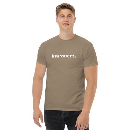 Man wearing a brown t-shirt with 'Introvert' logo on a white background