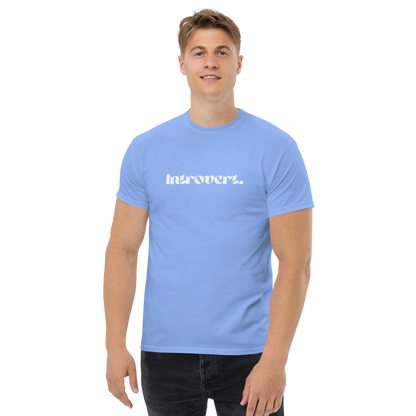 Person wearing a light blue t-shirt with 'Introvert' text on a white background