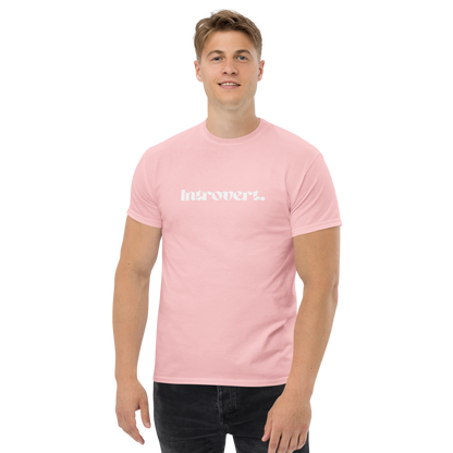 Man wearing a pink t-shirt with text on a white background