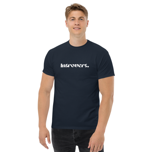 Man wearing a navy blue t-shirt with 'Introvert' text on a white background