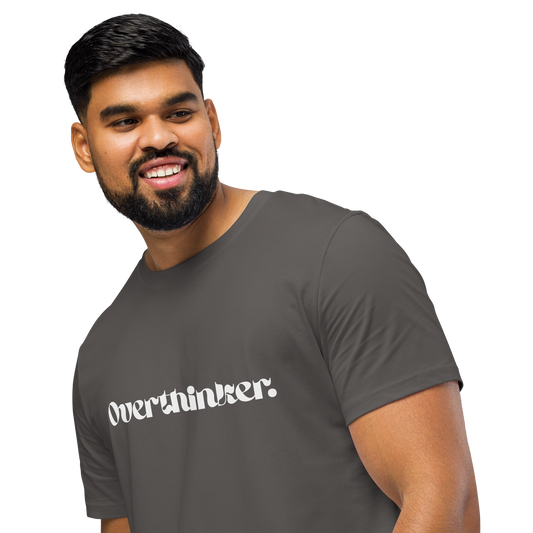 Man wearing a gray t-shirt with 'Overthinker' text on a white background