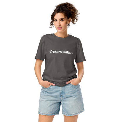Woman wearing a gray t-shirt with 'Overthinker' text and denim shorts on a white background
