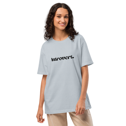 Woman wearing a light blue t-shirt with text on a white background